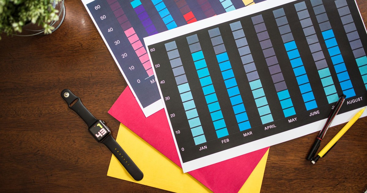 A wall calendar and a paper project plan on a desk, representing a multi-month audit schedule