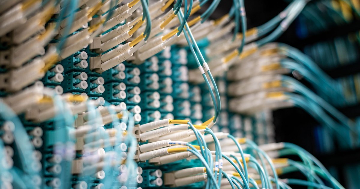 A radar-style sweep pattern overlaid on a circuit board and network cabling